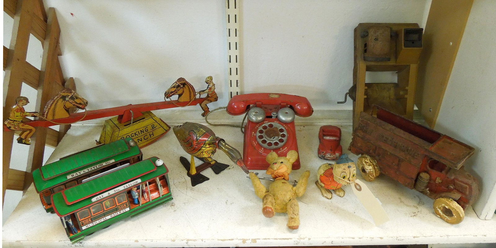 Group of Vintage Metal and Other Toys.: Group of vintage metal and other toys, including a Courtland wind-up Rocking R Ranch seesaw and other wind up toys.