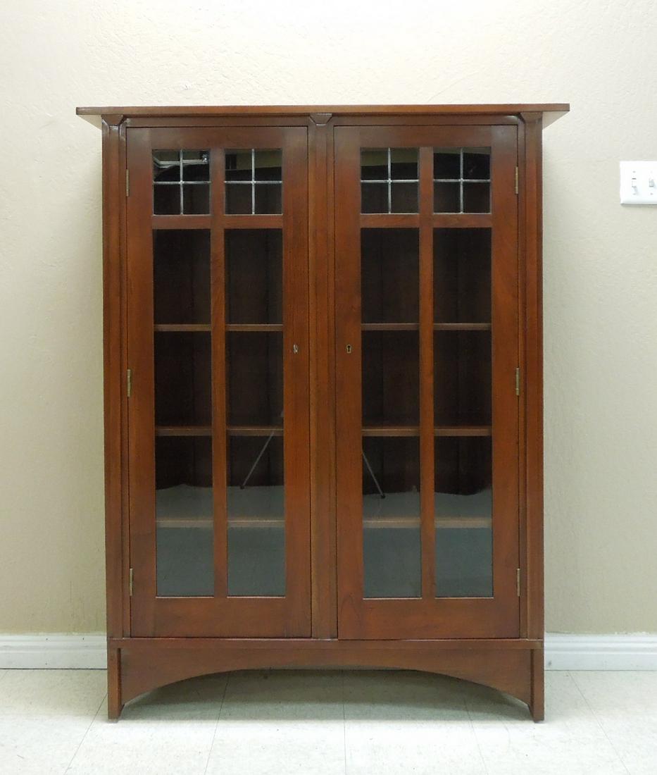 Stickley Arts & Crafts Style Bookcase.: Stickley Arts and Crafts style bookcase with 2 glaze doors. 46" x 14 1/4" x 58 1/4".