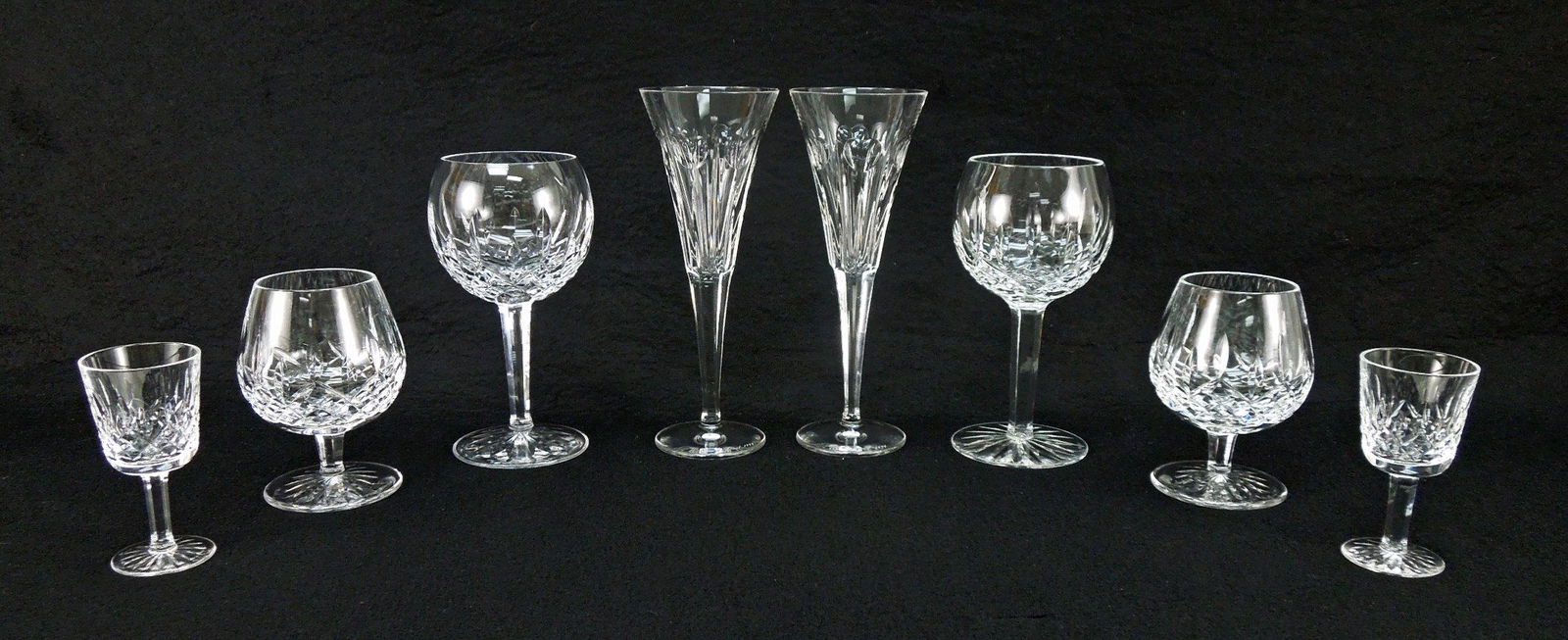 Waterford Crystal Stemware (8).: Group of Waterford crystal stemware, 8 pieces. (2) Wine goblets (7 5/8"), (2) Brandy snifters (5 1/4"), (2) David Grant 1999 Champagne glasses (9 1/4") & (2) Liqueur glasses (4 1/4").