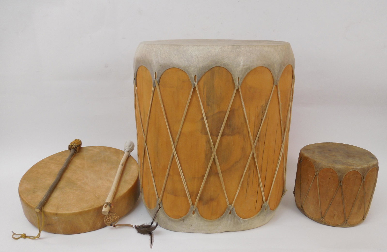 Group of Wood and Rawhide Drums.: 3 Native American wood and rawhide drums.