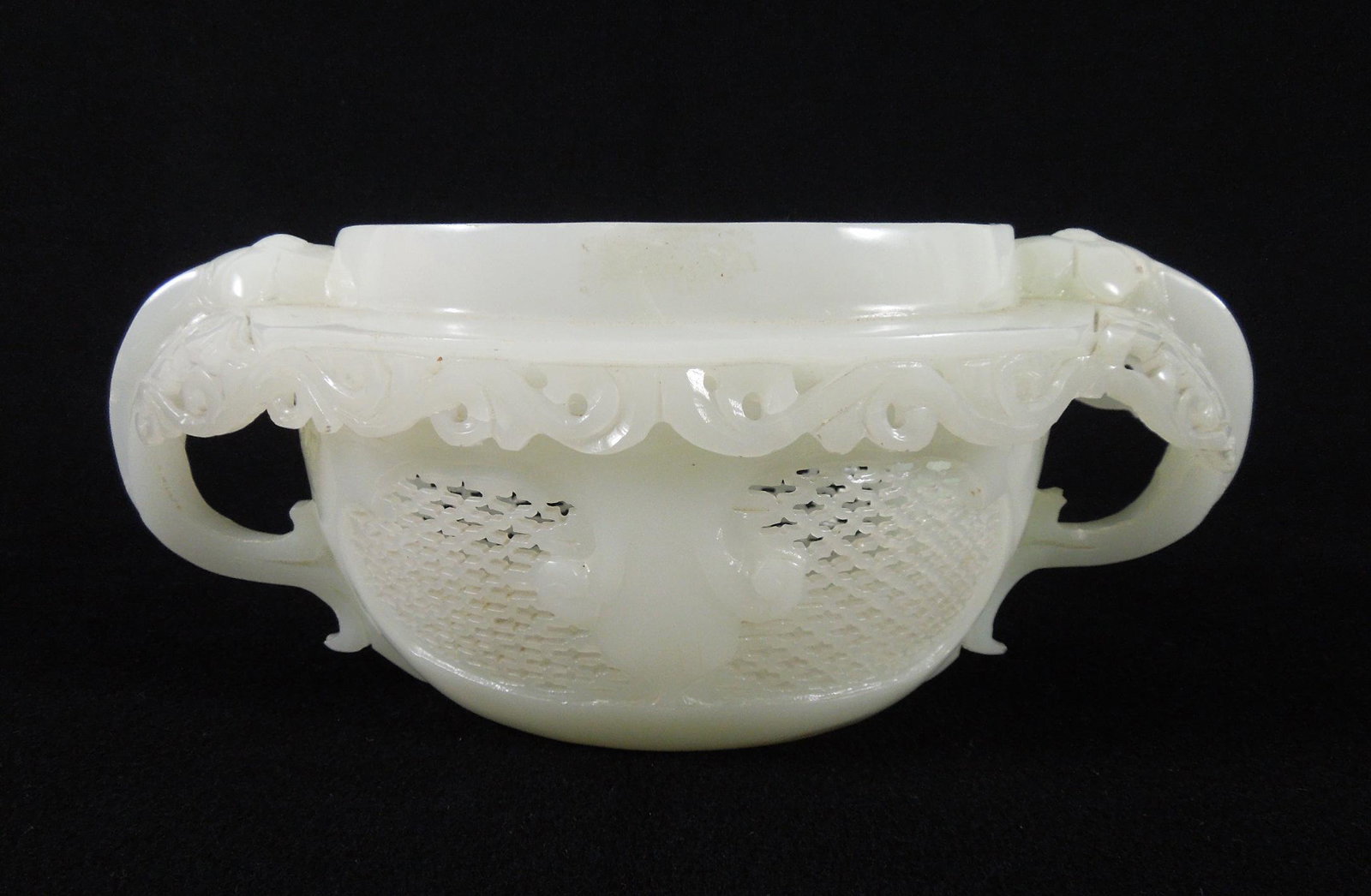 Chinese Carved 2-handled Vessel.: Chinese carved jade 2-handled vessel. 4" H x 9-1/2" L x 5-1/2" W.