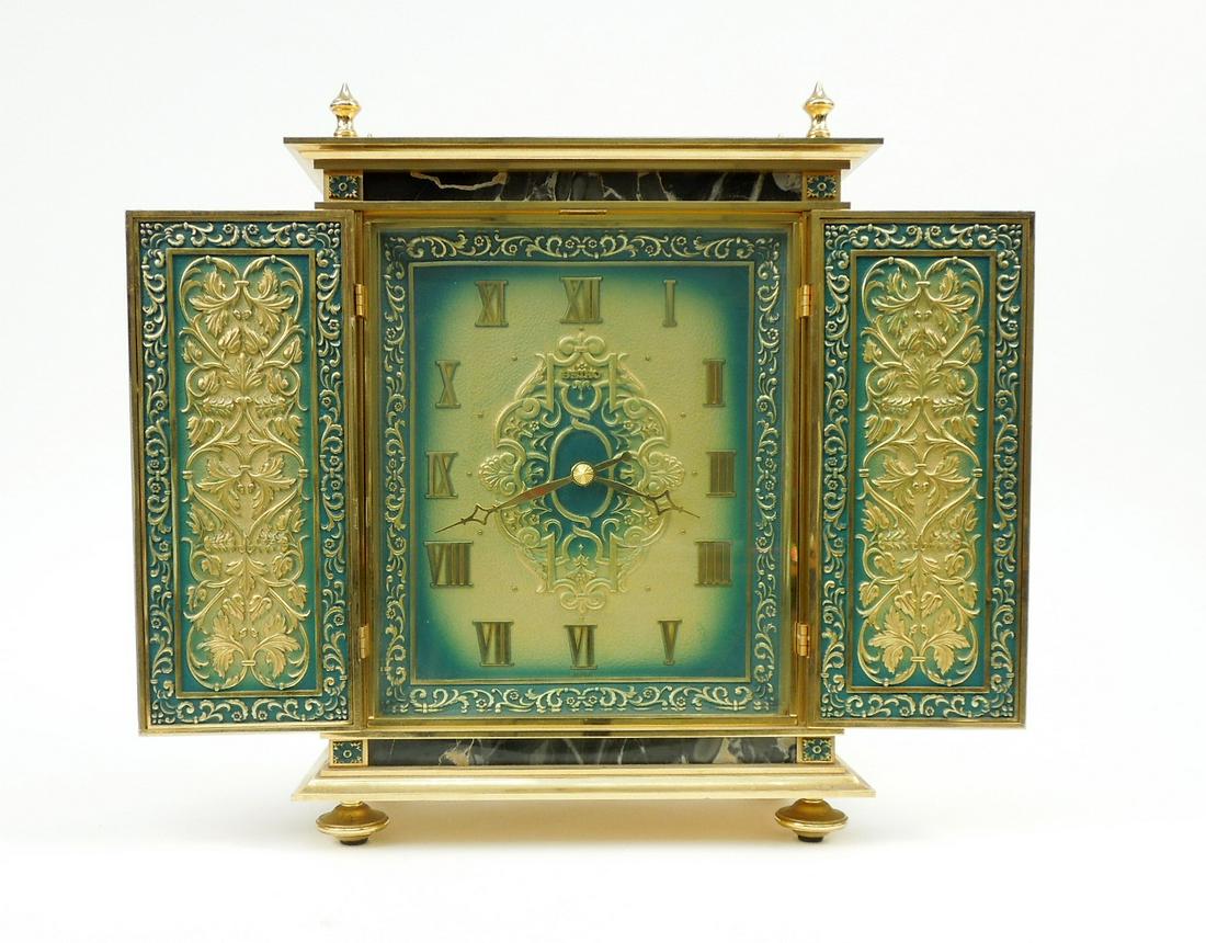 Seiko French Style Gilt Metal Mantle Clock.: Seiko French style ornate gilt metal and verdigris cased mantle clock. Arabesque relief decoration to both sides of double doors, opening to a conforming clock face, faux marble embellishments. ATZ-95