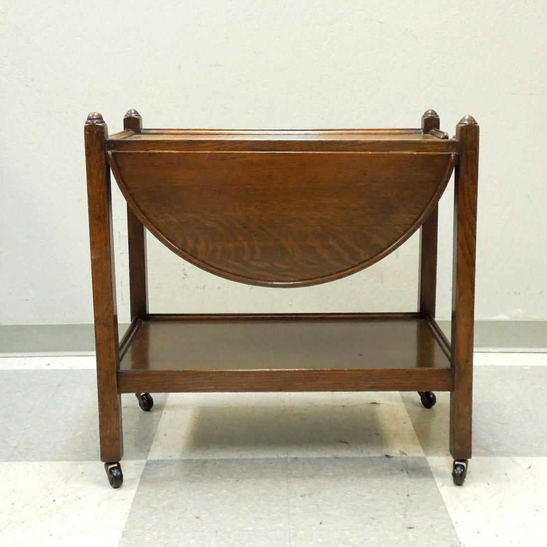 Oak Drop Side Rolling Tea Cart.: 1930s oak drop side rolling tea cart trolley. Approximate dimensions 29.5" L x 18.5" W (with sides down) x 29.5" H.