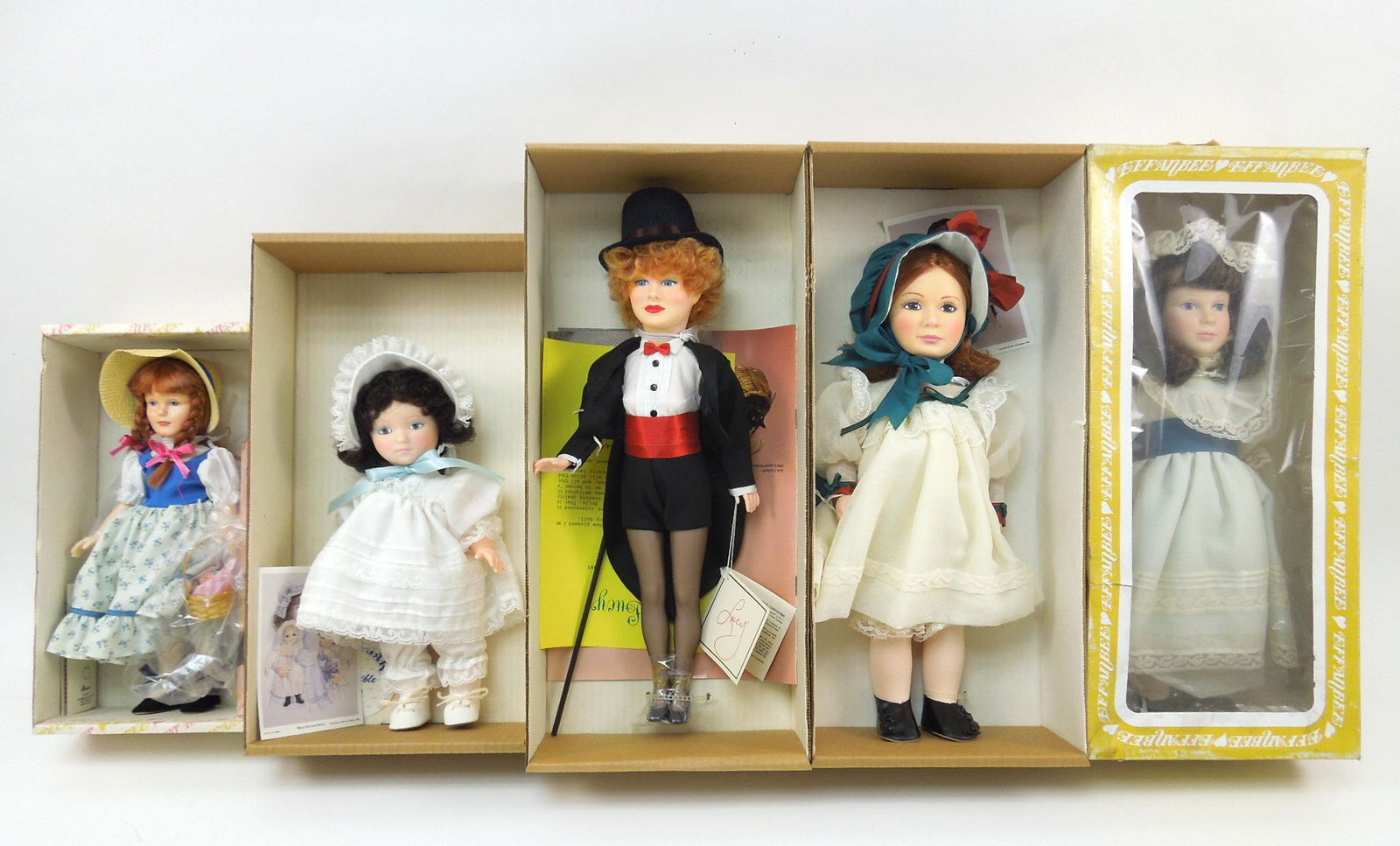 Five Effanbee Dolls with Box.: Five Effanbee dolls in box. Includes no. 7633 Becky Thatcher (11"), Jan Hagara no. 7487 Molly (11"), no. 1985 Lucille Ball (16-1/2"), Jan Hagara no. 7485 Leslie (15"), Jan Hagara no. 7483 Christina (1