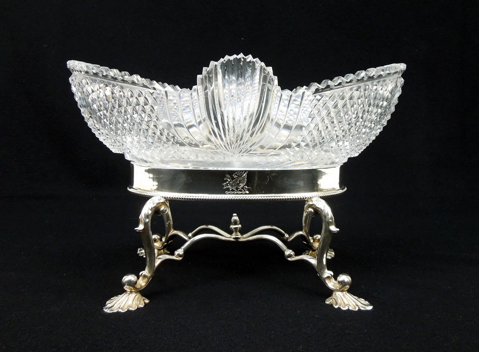 Cut Glass Centerpiece Bowl on English Silver Stand.: Oval cut glass centerpiece bowl on English Silver Stand. London 1797 hallmark, Henry Chawner & John Eames maker's mark. Overall: 10 3/4 x 7 1/2 x 7 inches. Stand: 17.5 troy oz.