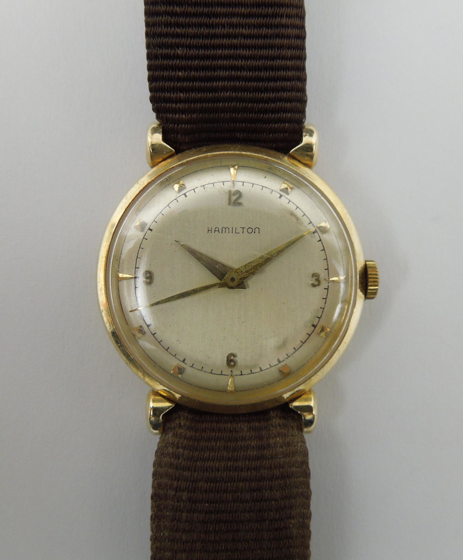 Vintage Hamilton Wristwatch with 14K Gold Case Back.: Vintage Hamilton wristwatch with 14K gold case back. With associated strap. Watch: 22.4 grams.