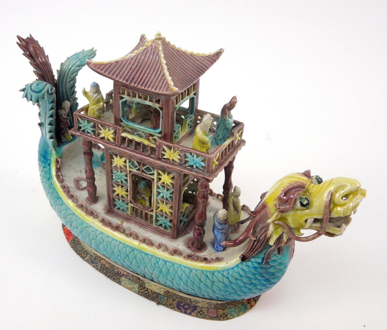 Chinese Porcelain Dragon Boat in Display Case.: Chinese porcelain dragon boat in display case. 9 x 6 1/2 inches. Boat with sheltered structure and figures.