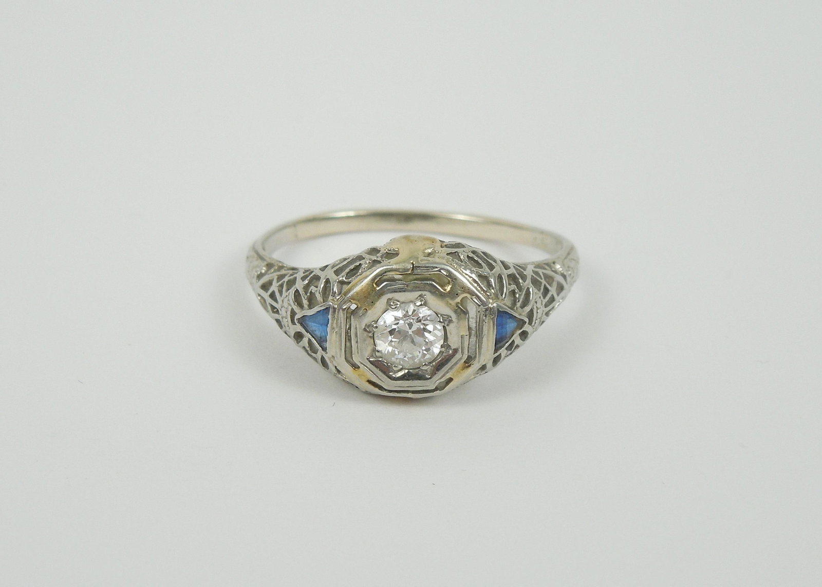 Vintage White Gold Ring with Diamond.: Vintage white gold ring with round brilliant cut diamond and 2 blue stone accents. Tests 14K. Approx. 0.25 ct. 2.5 grams total.