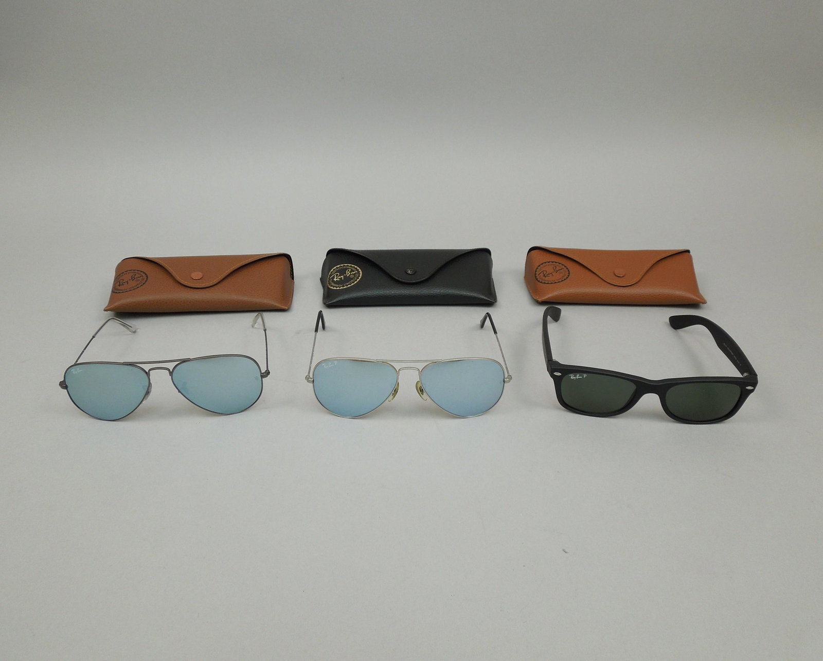 (3) Pair of Men's Rayban Sunglasses with Cases.: (3) Pairs of Men's Rayban sunglasses with cases.