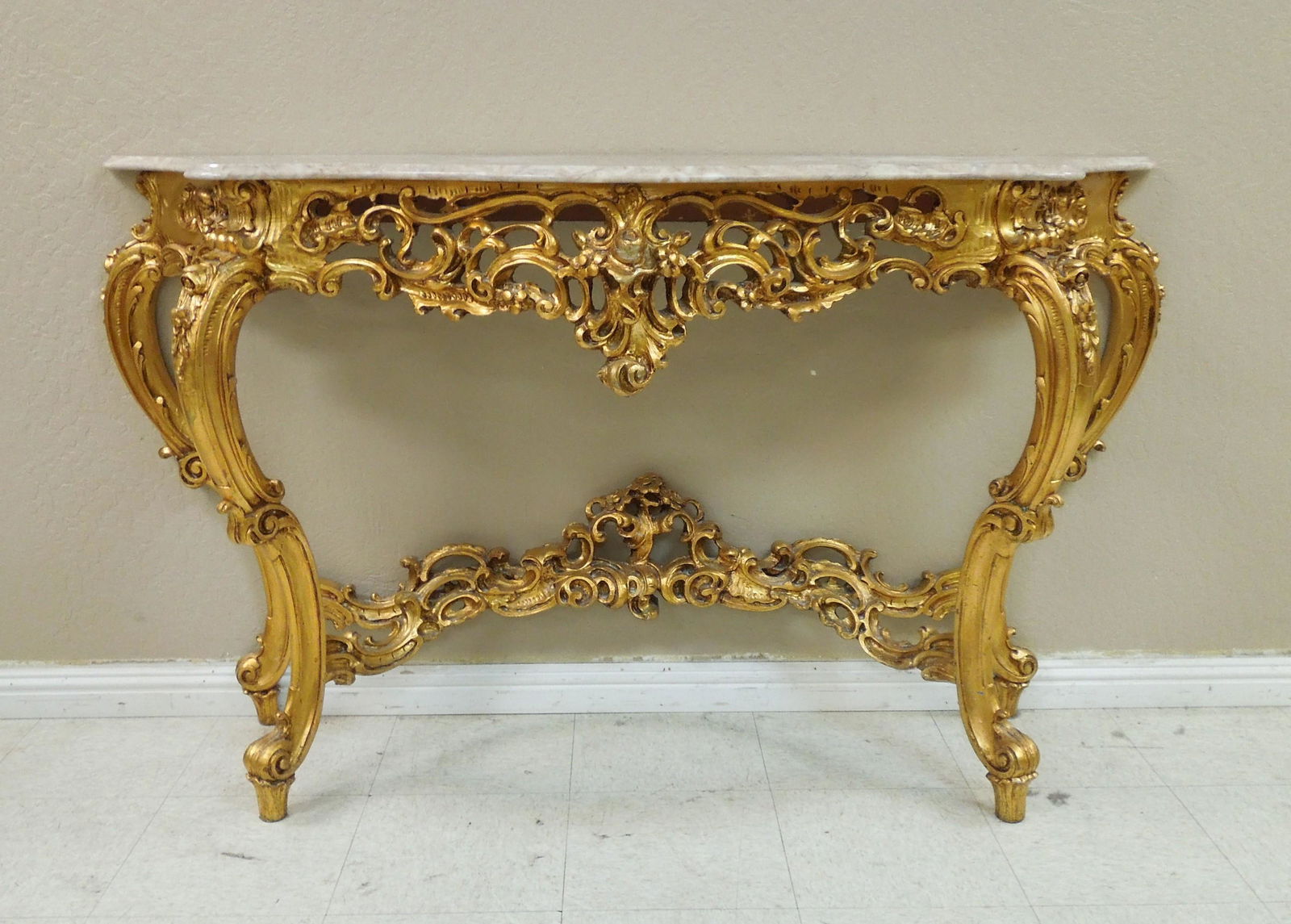 Louis XV Style Gilt and Marble Console Table.: Louis XV style gilt and marble top console tables. 66 x 20 x 36 1/2 inches.
