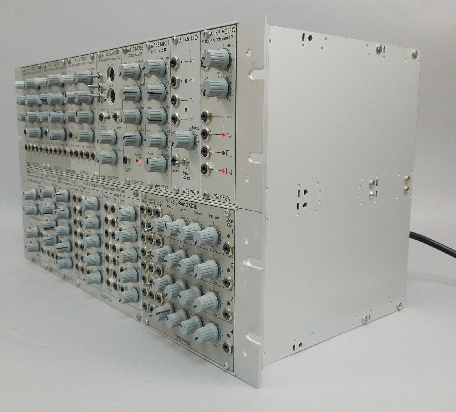 Doepfer A-100 Eurorack Modular Synth System.: Doepfer A-100 Eurorack-format modular analog synth system loaded with Doepfer synth modules. Contains Doepfer two A-111 VCO, A-112 sampler, A-118 noise, A-138 mixer, A-145 LFO, A-147 VCLFO, A-149-1 RV