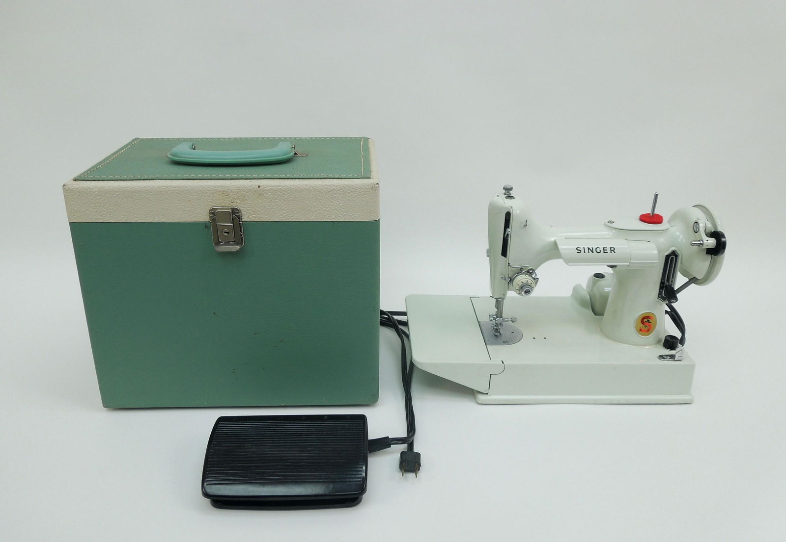 Singer 221K Featherweight Sewing Machine with Case.: Singer 221K Featherweight sewing machine with case. Serial No. EV997641. White color machine with foot pedal and bobbin holder.