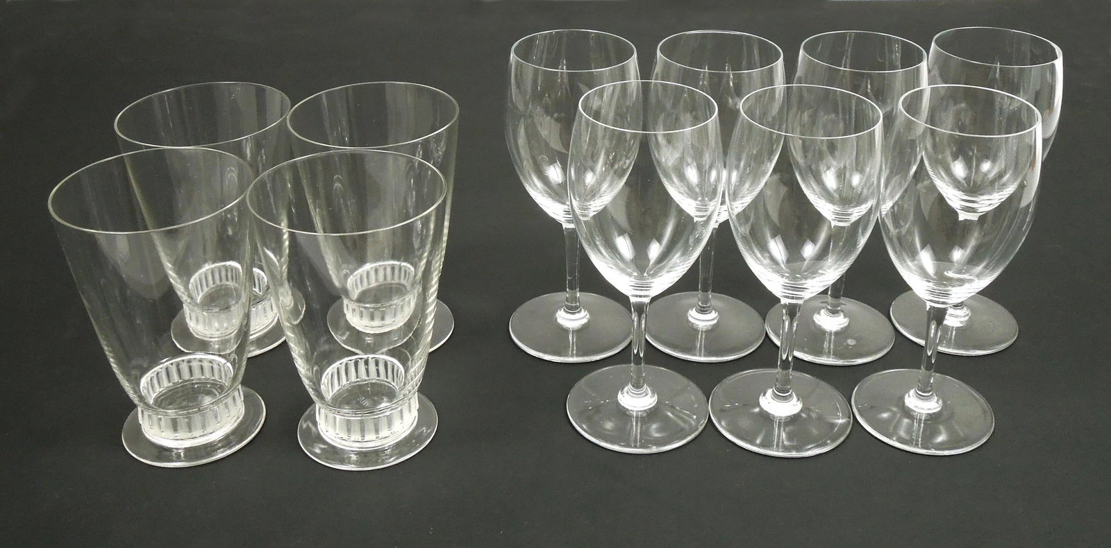Group of Baccarat & R. Lalique Glassware.: Group of Baccarat and R. Lalique glassware. (7) Baccarat clear stem wine glasses (6 5/8") & (4) R. Lalique footed tumblers (5 1/8".