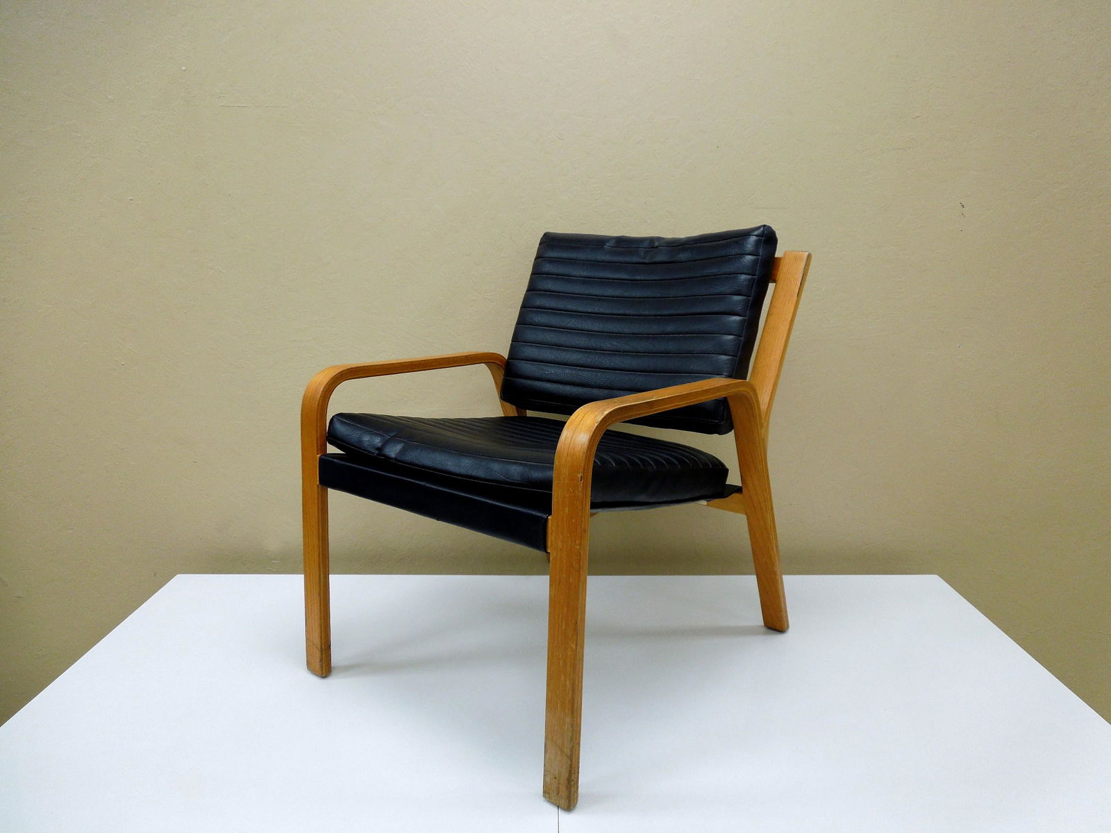 Plycraft Bentwood & Vinyl Armchair.: Plycraft bentwood armchair with vinyl seat, cushion and head rest. Approx. 25" W, 28" D, 32.5" H.
