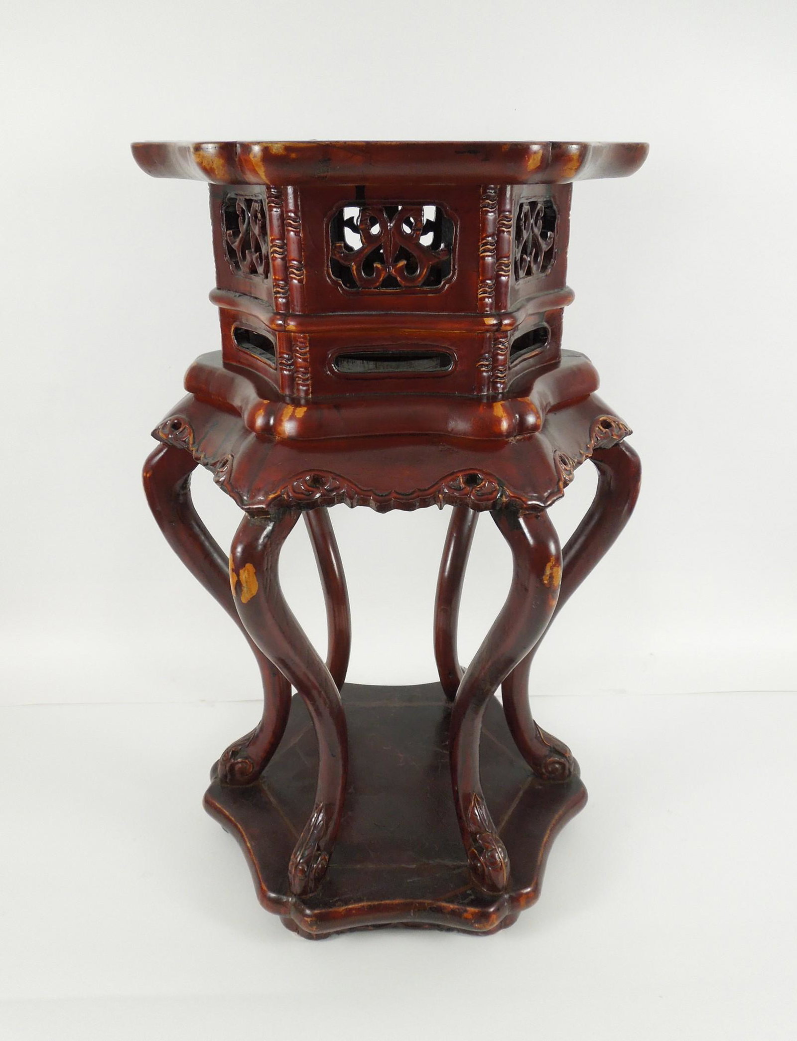 Chinese Jardiniere Stand, Early 20th C.: Chinese lacquered wood jardiniere stand with shaped hexagonal top. Carved openwork frieze, skirted waist. Raised on 6 curved legs and conforming base. Early 20th C. Height: 29 in. x Diameter: 17 in.