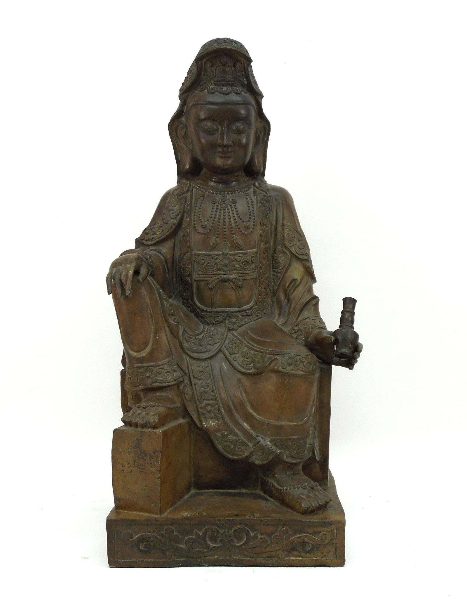 Chinese Bronze Figure of Guan Yin.: Chinese cast bronze sculpture cast as a seated Guan Yin with right palm resting on raised knee, left hand with water dropper. The robe border decorated in relief with leaves and flowers. Beaded neckla