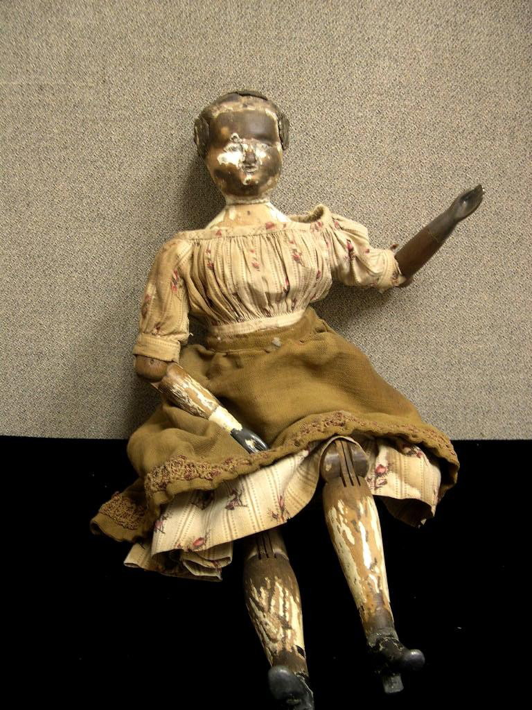 19th Century Joel Ellis American wooden doll: 19th Century American wooden doll by Joel Ellis Springfield. Carved facial features and hair, remnants of gesso on head and lower extremities. All dowel jointed wooden body, pewter hands and feet. Lef
