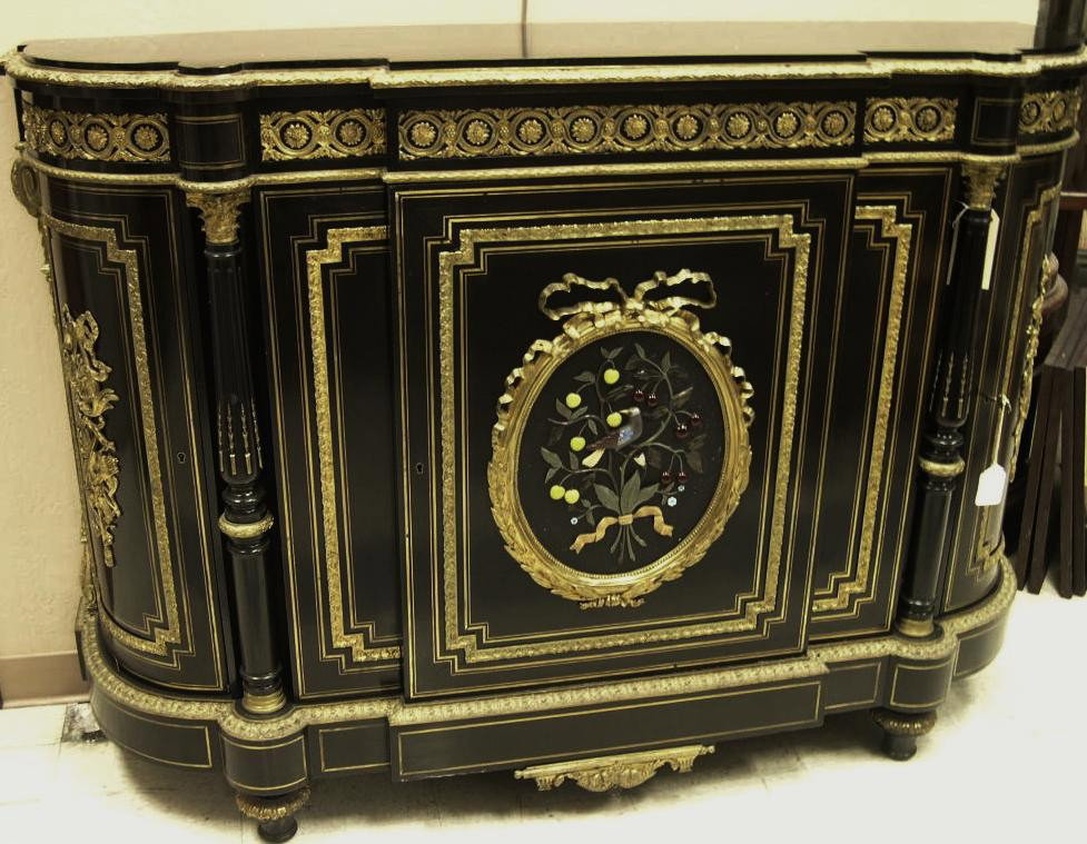 Napoleon III ebonized Console Cabinet: Napoleon III ebonized Console Cabinet. Of demi-cartouche form, the case outset at front with a prominent central flat-faced cabinet, the door applied with bronze dore ribbon and bowknot medallion, fra