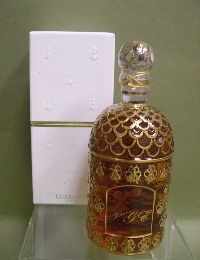 Guerlain Gilt “SHALIMAR” Parfum, 250ml/8.5 fl.oz: Perfume, Guerlain, Paris “SHALIMAR” Parfum, 250ml/8.5 fl.oz., the bottle decorated with a gilt-gold bee pattern, sealed and in original box. Label underfoot numbered "G010456". The bottle monogram