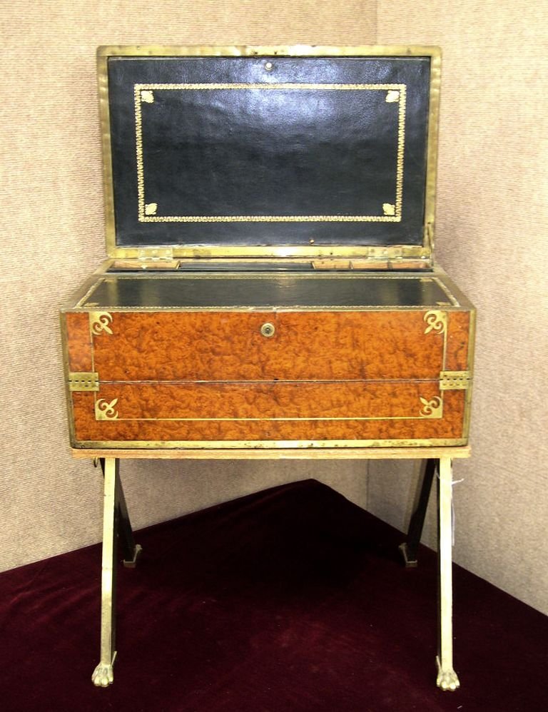 Travelling Writing Desk burl walnut hinged box on s: Travelling Writing Desk, burl walnut hinged box with inlay brass decoration, interior fitted with tooled and gilt leather writing surface and compartments for ink bottles, etc., raised on tripod form 
