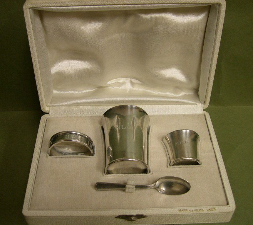 Mappin & Webb, Paris, Silver Christening Set -4pc: Mappin & Webb, Paris, Silver Christening Set, 4 pieces in a presentation box, consisting of a spoon, a large and small beaker and a napking ring, with monogram MLG. Stamped Minerva Mark Maker: Ravinet