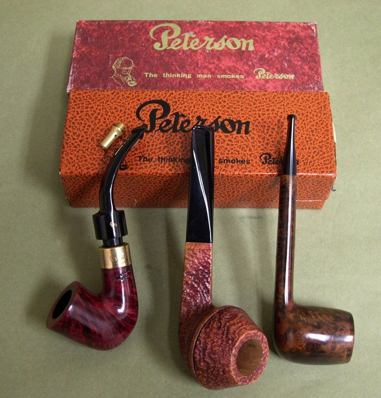 Three (3) Smoking Pipes: Petersons, Per Jacopo, Com: Three (3) Smoking Pipes (unsmoked), including a Petersons “Supreme” with gold metal ferrule (apparent stamped hallmark is illegible), a Per Jacopo, Italy, “Maxima S2” and a Comoys, London “K