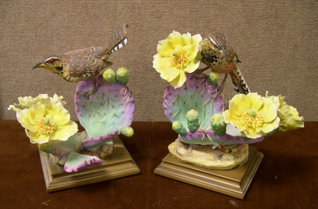 Pair Royal Worcester Dorothy Doughty Birds Cactus W: Two Royal Worcester porcelain bird figures titled “Cactus Wren Heleodytes Brunneicapillis Couesi & Prickly Pear” by Dorothy Doughty, signed underglaze. Height: 11 inches approx.