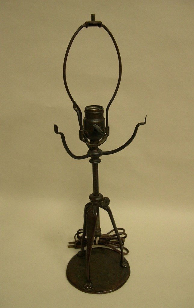 Tiffany Studios New York Bronze Lamp Base S163 323: Tiffany Studios New York, bronze lamp base, stamped S163 and 323. Circular base, tripod design of three legs terminating in paw feet emanating from a center column, supporting three arms to hold a sha