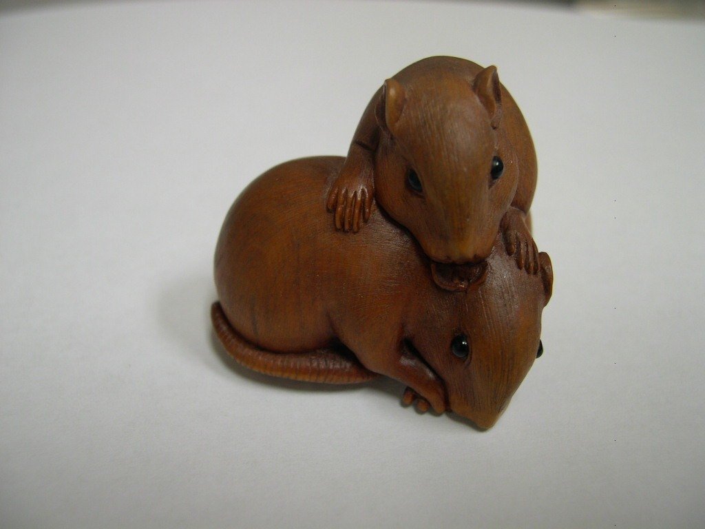 Japanese Carved Boxwood Netsuke 2-Mice Signed: Japanese carved boxwood netsuke depicting two mice, with inset glass eyes. Signed. Size: 1 ½ x 1 ½ x 1 ½ inches