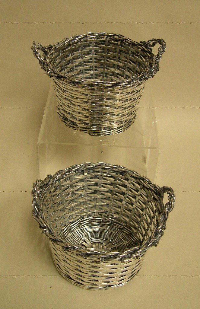 Pair of Christofle France Woven Baskets: Pair of Christofle, France woven silverplate 2-handled baskets. Stamped: CHRISTOFLE 44334 Height: 4 inches; Diameter: 5 inches