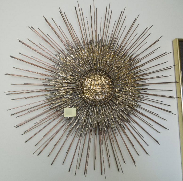 Metal Wall Sunburst Sculpture Curtis Jere Style: Metal Wall Sculpture, in the style of Curtis Jere. No apparent signature Sunburst formed of emanating metal rods Diameter: 30 ½ inches.
