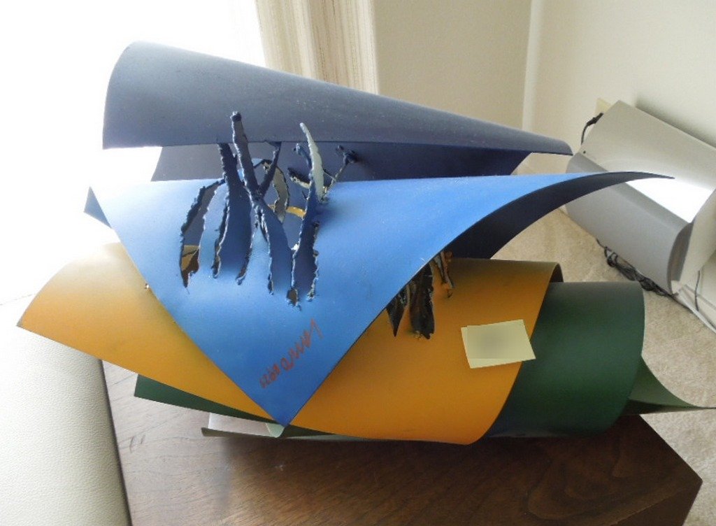 Roberto Lauro Abstract Metal Sculpture: ROBERTO LAURO (Swiss, 1932) Abstract painted metal sculpture an assembly of metal rolls, some with jagged surfaces 14 x 21 x 15 inches.