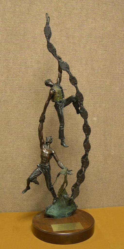 Jasper D’Ambrosi Bronze Sculpture #7/25: Jasper D’Ambrosi Bronze Sculpture #7/25, signed and numbered, depicting a two man rescue at sea. Presentation plaque on wood base dated 1987. Jasper D’Ambrosi (American,1926 - 1986) Dimensions” 
