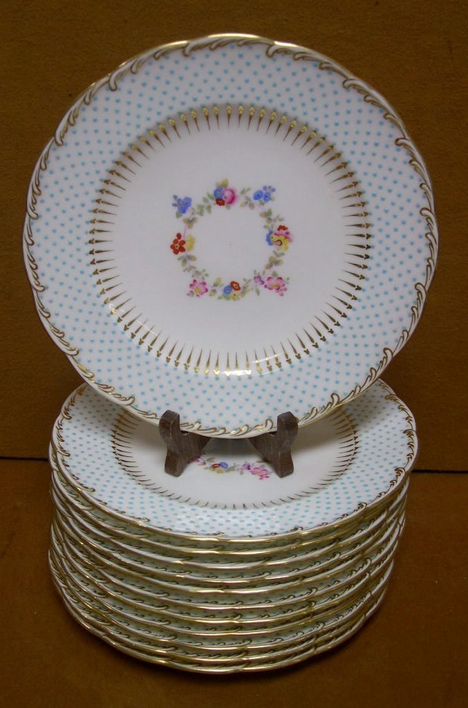 Minton England Porcelain Plates #G7347 Aqua & Floral: Twelve (12) Minton England porcelain plates with aqua beaded rim, floral center reserve and gold trim, on a white ground. Pattern #G7347. Retailer: Nathan Dohrmann Co., San Francisco. Diameter: 7 ¾ i