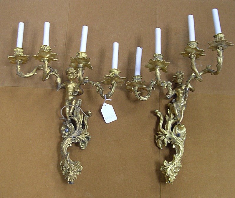 Pair Gilt Bronze 4-arm Candelabra Wall Sconces: Pair of gilt bronze Candelabra Wall Sconces. Each sconce having 4 arms, figural and foliate scroll, 4-arm. (Wired for electricity).