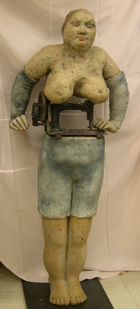 Vilma Villaverde Modern Sculpture Standing Woman: Vilma Villaverde (Born 1942), modern stoneware and metal sculpture, Standing Woman (Sewing Machine). 69 x 20 x 20 inches.