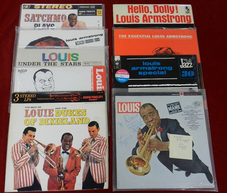 (12) Louis Armstrong LPs: Twelve (12) Louis Armstrong LPs: Louis, with an autographed cover, Mercury SR 61081, stamped on back cover promo copy not for sale; Special, CBS 65251, French import; The Essential Louis Armstrong, Ve