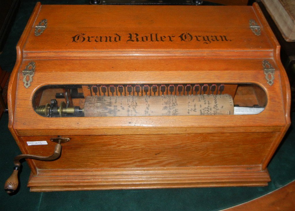 Grand Roller Organ, Autophone Company: Grand Roller Organ manufactured by the Autophone Company, Ithica, NY. 13" 32-note roller, Oak case. Date stamped on bottom appears to read Feb 12, 1895.