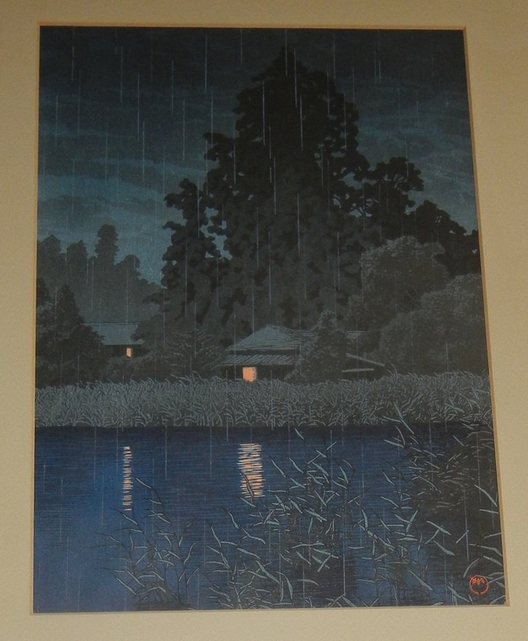 Kawase Hasui, Color wood cut print.: Kawase Hasui (Japanese 1883-1957) Color wood cut print. Titled: Rain at Omiya. Framed and matted. Sight: 14¼ x 10¼ inches. Overall: 24¼ x 19½ inches.