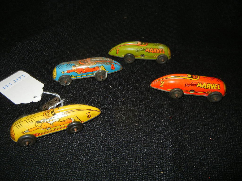 Set of four (4) 1947 Captain Marvel wind-up toy cars.: Set of four (4) 1947 Captain Marvel wind-up toy cars.