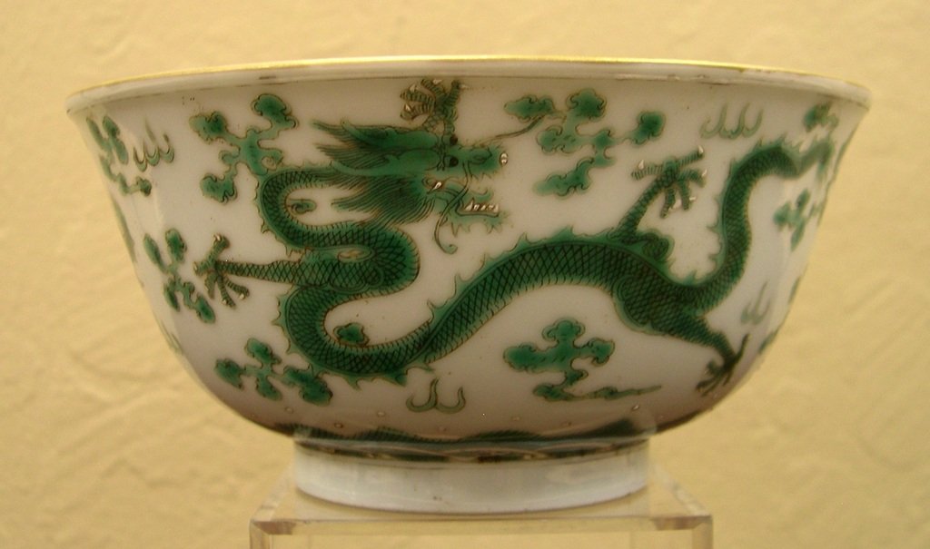 Chinese Green Glaze Enamel Dragon Bowl. Four dragons: Chinese Green Glaze Enamel Dragon Bowl. Four dragons with five fingers surround body, ocean waves around the bottom. A red six character seal on the base reads:" Da Qing Dao Guang Nian Zhi". Diameter: