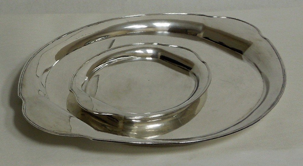 (2) German 800 silver oval trays - matching: (2) German 800 silver oval matching trays with molded rims. With crescent and crown hallmarks, 800, Gebr. Friedlander. 26 x 16 5/8 inches. 67.52 ozt., 13 ¾ x 8 ½ inches. 13.89 ozt.