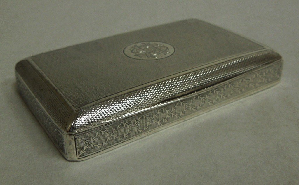 Continental Silver Card Case: Continental silver card case, engine turning and garland decoration. Piano hinged lid is centered with monogrammed reserve. Gilt wash interior. Marked: 935. 2.37 ozt. ½ x 3 ¼ x 2 inches.