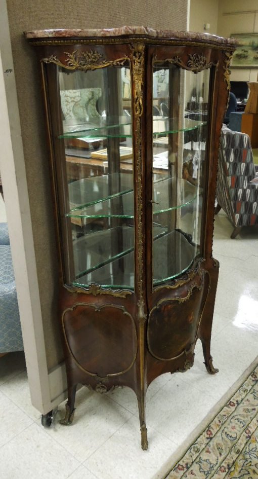 Verni Martin Style Ormolu Mounted Marble Top Vitrine: Verni Martin style marble top rosewood veneered vitrine, the upper display with curved glass front and sides. The lower bombe case paint decorated with romantic genre and vacant cartouches. Applied ov