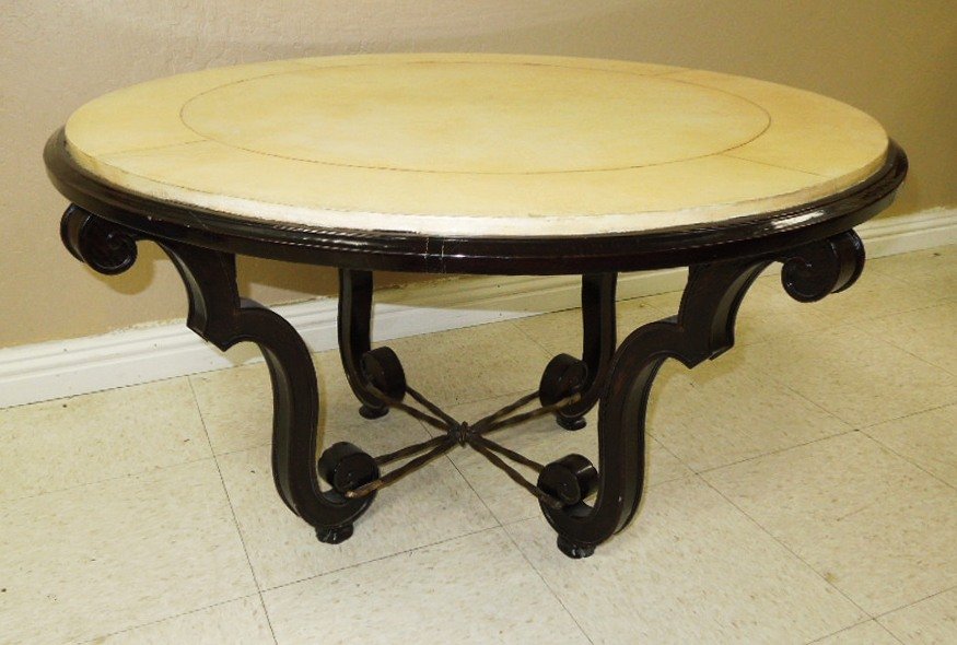 French faux stone top coffee table: French Art Moderne design coffee table. Circular faux white stone lacquered leather top on ebonized mahogany wood frame. Set on scrolling legs ending in metal animal paw feet. Height: 20 inches, Diame