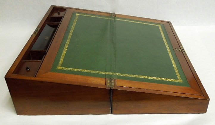 19th C. Gentleman's Writing Box.: English gentleman's mahogany writing box. Opens to a green tooled leather writing slope with interior and fitted compartments. 19th C. 8 x 21 x 11 inches (closed)