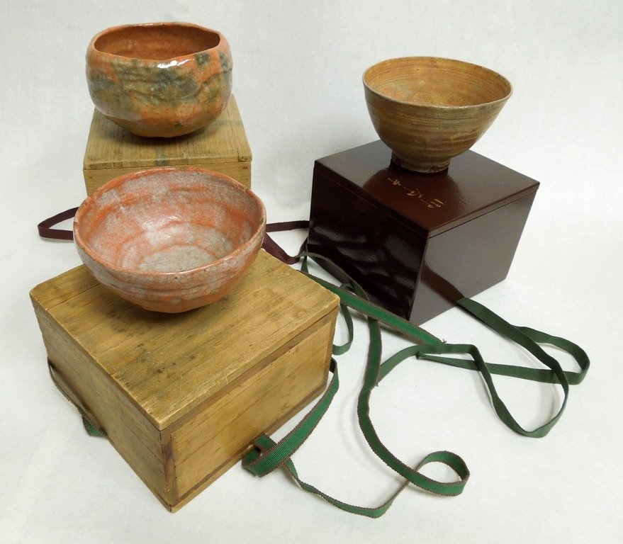 3 Japanese Pottery Cha-wan: 3 Japanese pottery cha-wan (tea bowls). Two with kiri wood, and one with lacquered wood box. Mid 20th Century.