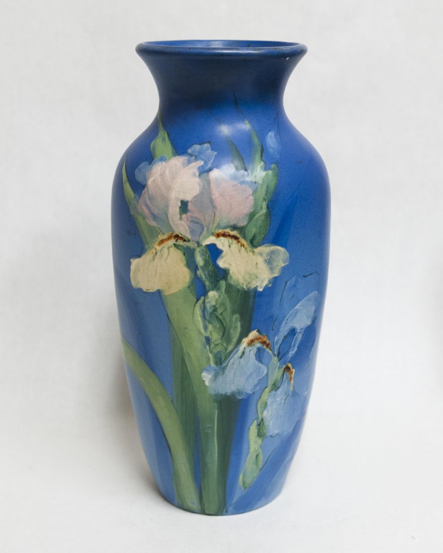 Weller Pottey Vase Signed McLaughlin: Weller Pottery vase, irises on a robbin-egg blue ground. Incised Weller Pottery mark on base, signed McLaughlin. Height: 15 1/2 inches.