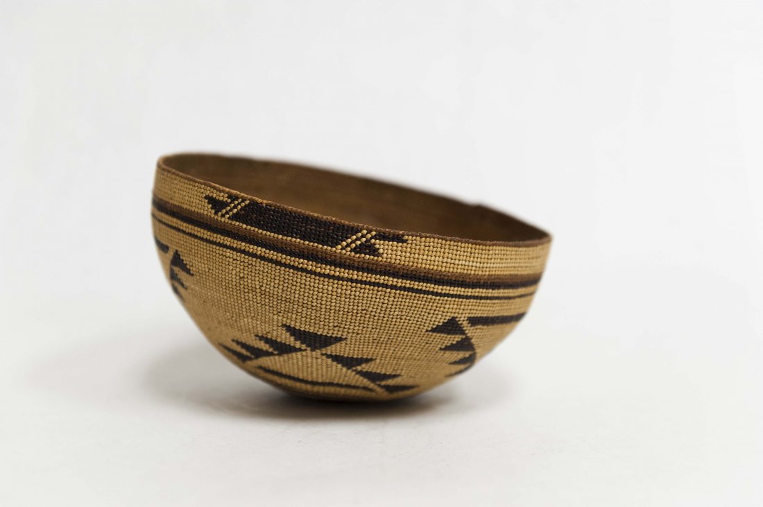 Native American Hupa Basket Hat: Circa 1900-1920s Native American Hupa basket hat. Extremely fine weave with seven pointed stars and surrounding bands in natural and dark fibers. Woven with split Pine roots, Bear grass, and Maiden Ha