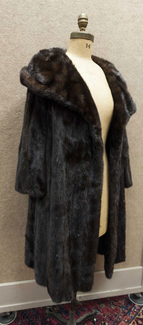 Lady's Brown Mink Coat: Lady's brown mink coat with deep collar. Joseph Magnin label. Approximate size 10-12.